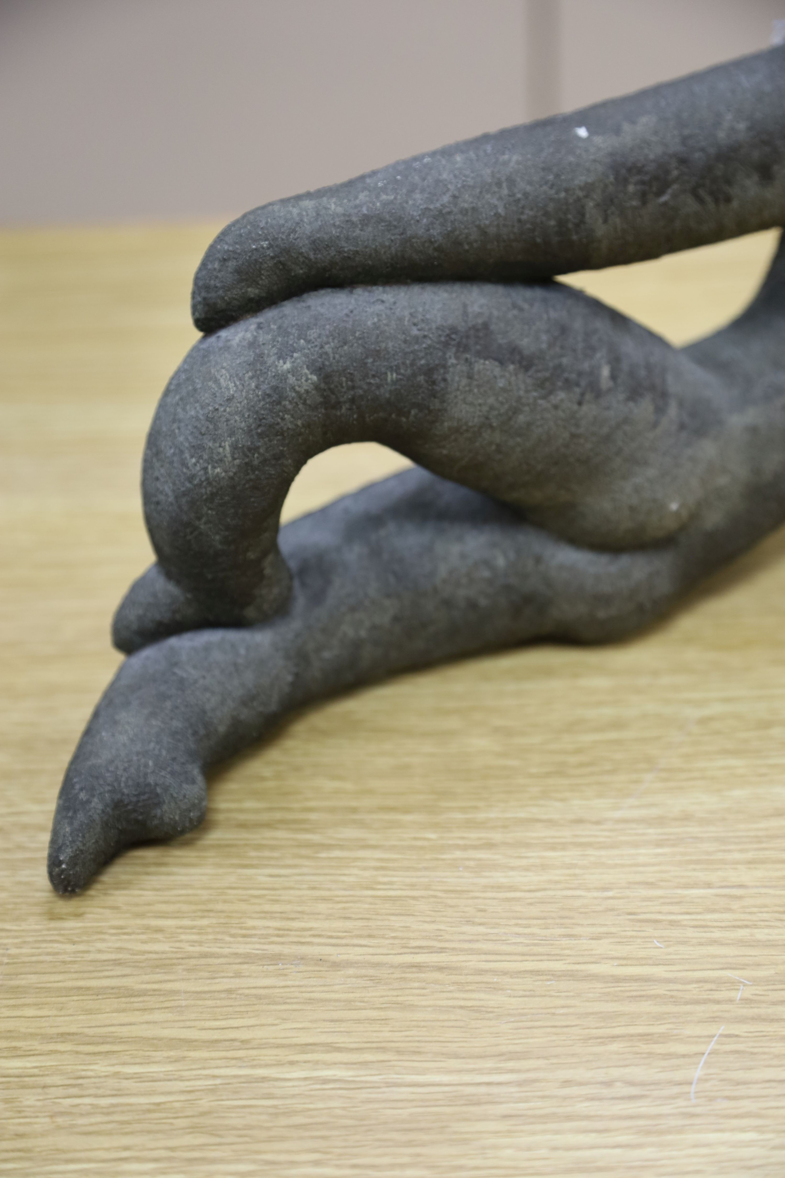 A bronzed pottery abstract figure, marked ‘WP 92’ 40cm